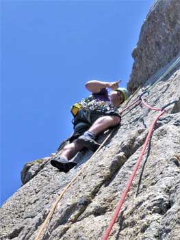 Cornwall rock climbing guide leading a route at Chair Ladder, a granite cliff near Land's End and Penzance. 