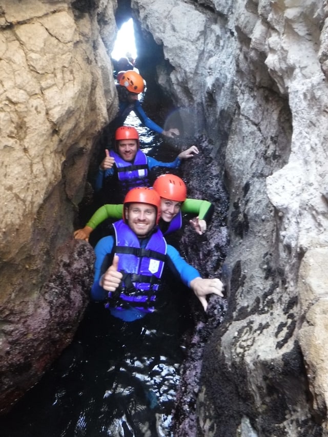 Coasteering group in a cave in Montenegro