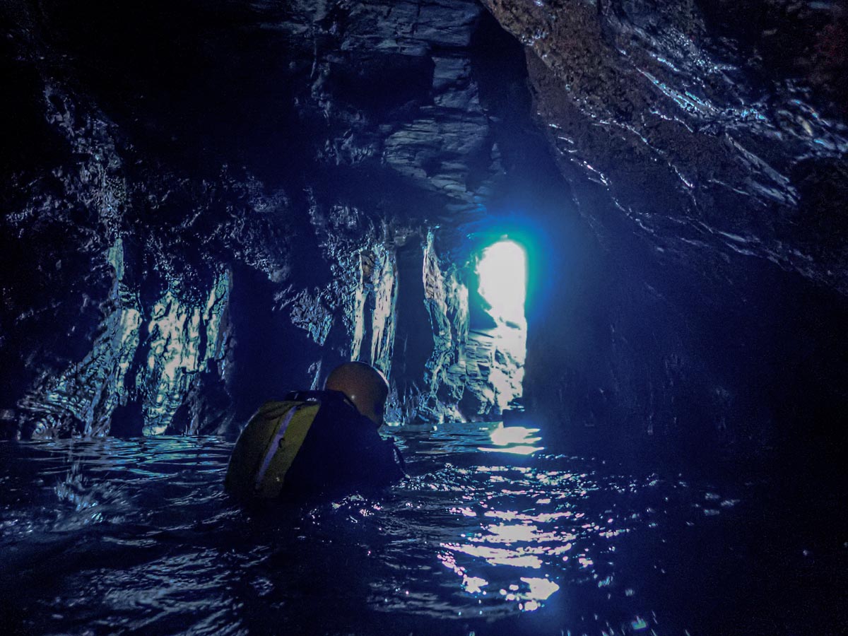 Exploring a huge sea cave near Godrevy in west Cornwall