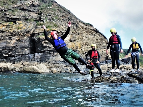 SUP, surfing and coasteering is popular in Cornwall. Here we see coasteering at Praa Sands, a session with Kernow Coasteering. C