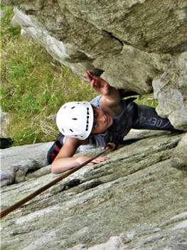 Young person on a beginner rock climbing course in Cornwall.