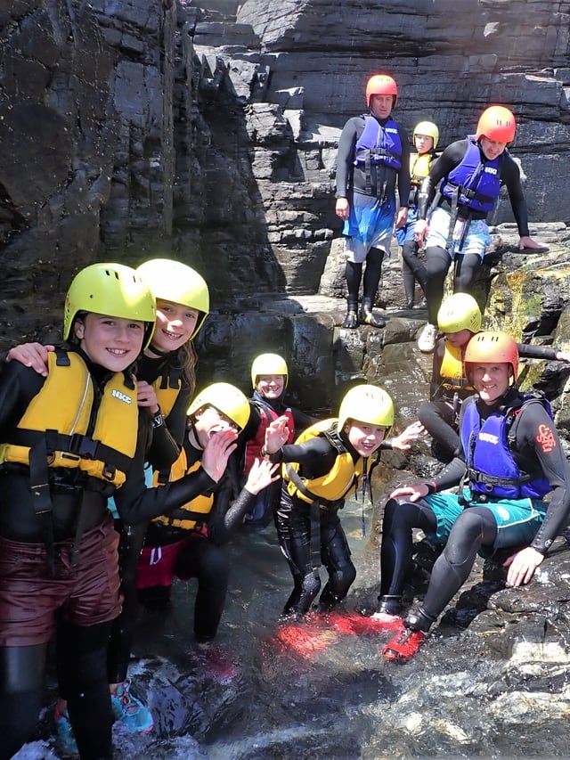 Group coasteering at Praa Sands in Cornwall with Kernow Coasteering