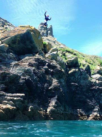 Huge cliff jump at Prussia Cove with Kernow Coasteering. Best coasteering in Cornwall with Kernow Coasteering.