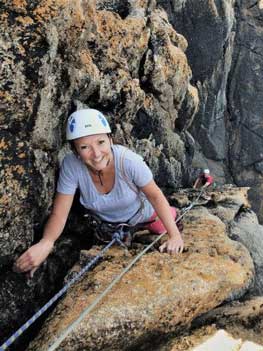 Rock climbing at Sennen with Kernow Coasteering on a rock climbing course.