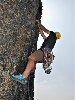 Kernow Coasteering rock climbing guide on Africa Route at Sennen on an advanced climbing course. Learn to climb in Cornwall with