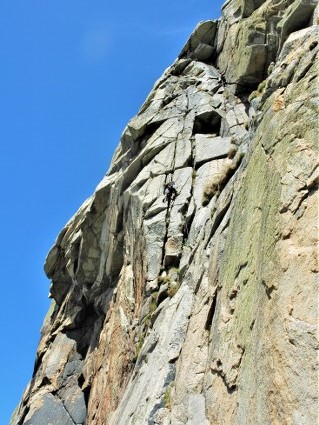 Cimbing Doorpost at Bosigran. A classic multi pitch rock climb at Bosgran near Penzance and St Ives in Cornwall. Rock climbing i