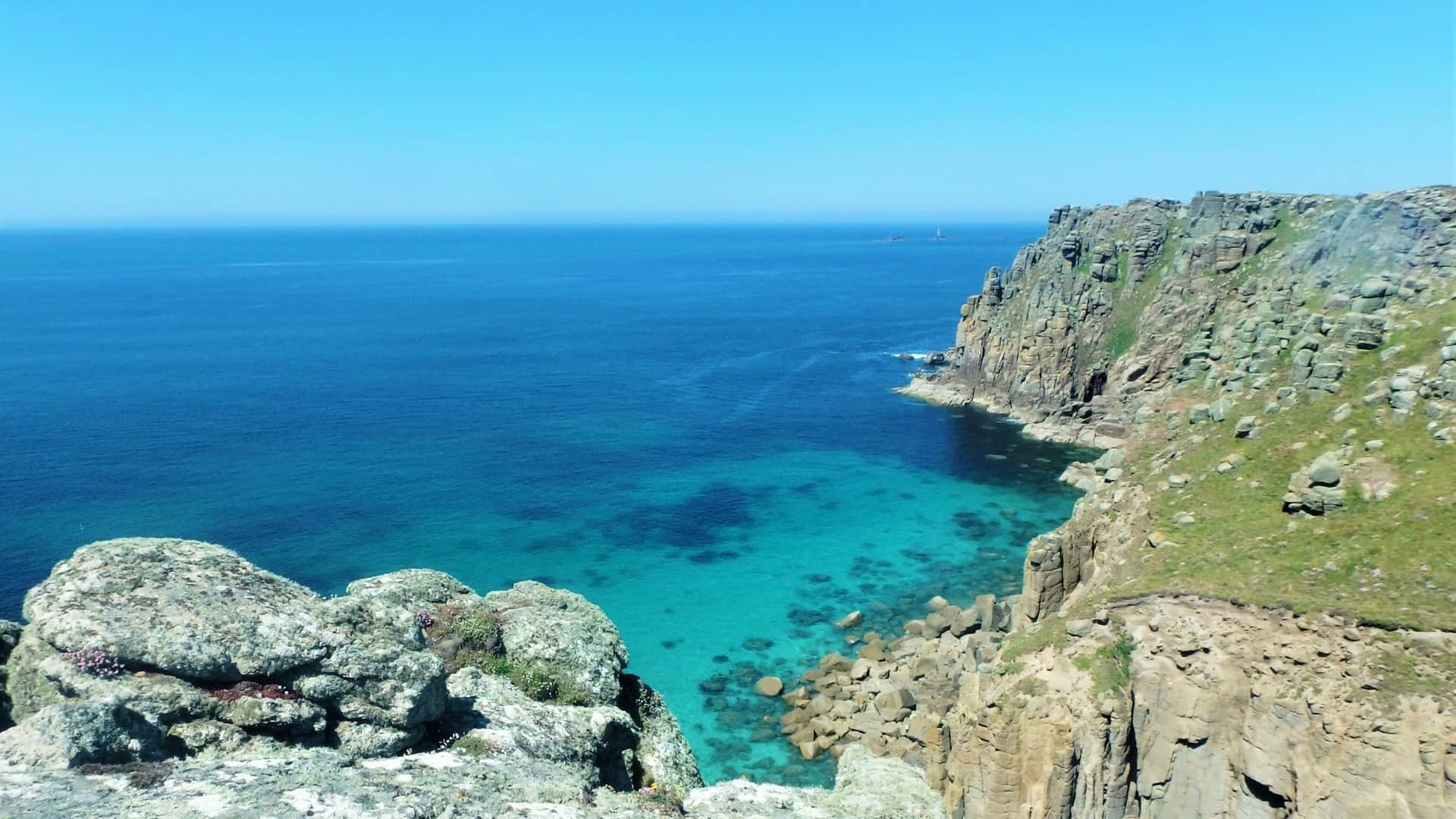 View from Carn Boel looking at Pordenack Point. Towering granite cliffs near Land's End in Cornwall