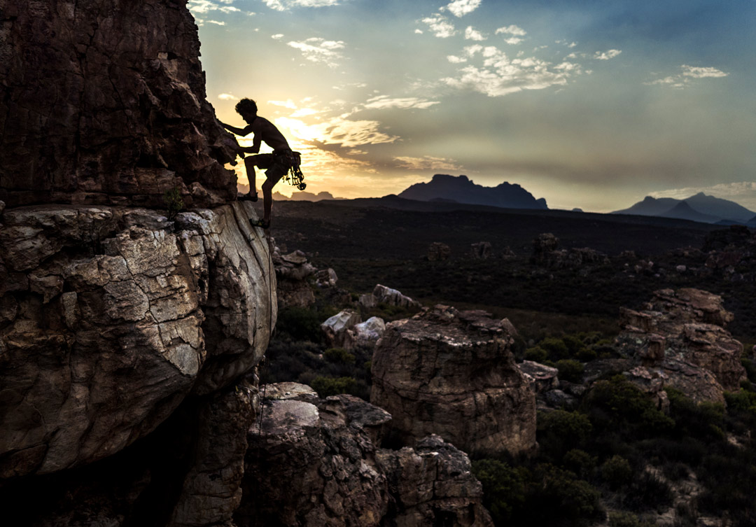 Climber at sunset in the desert