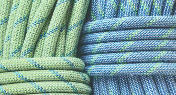 Close up to two climbing ropes coiled and ready for use