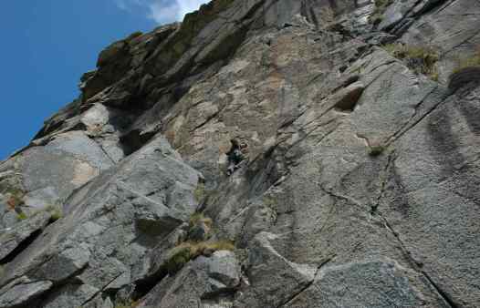 Rock climbers on Doorpost at Bosigran. A classic Cornish rock climbing route.