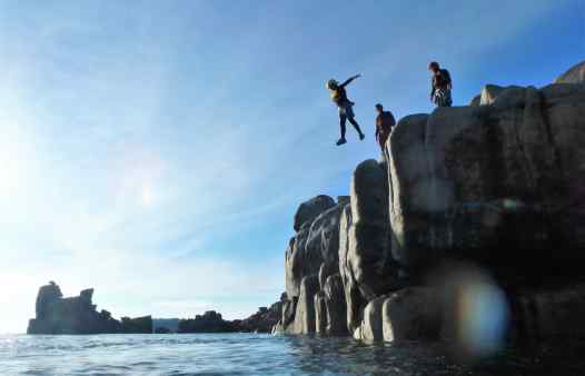 Jumping into the sunset, coasteering on the Isles of Scilly