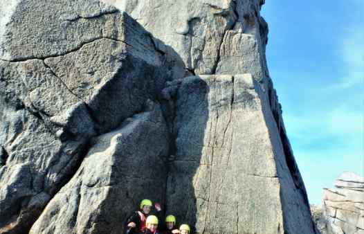 Group coasteering at Peninnis Head on the Isles of Scilly