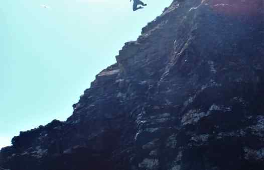 Huge jump form a cliff whist coasteering in Cornwall with Kernow Coasteering
