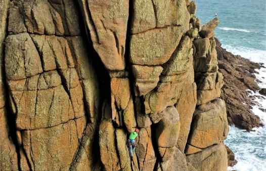 Climber on Sea Horse, HVS, at Chair Ladder, a rock climbing crag in Cornwall