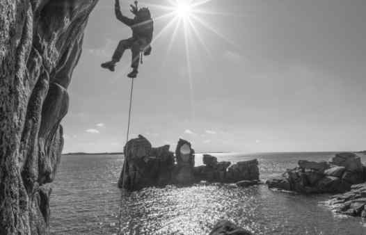 Working the moves on Rock Hard Peninnis, and tough rock climbing route on the Isles of Scilly