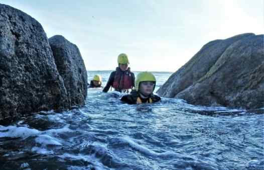 Swimming the clashing rock whilst coasteering on Scilly