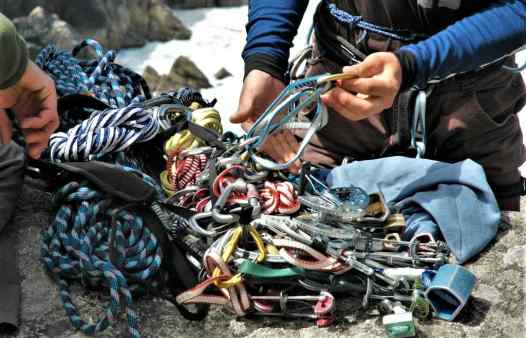 Sorting out rock climbing gear before climbing at Bosigran near St. Ives in Cornwall 