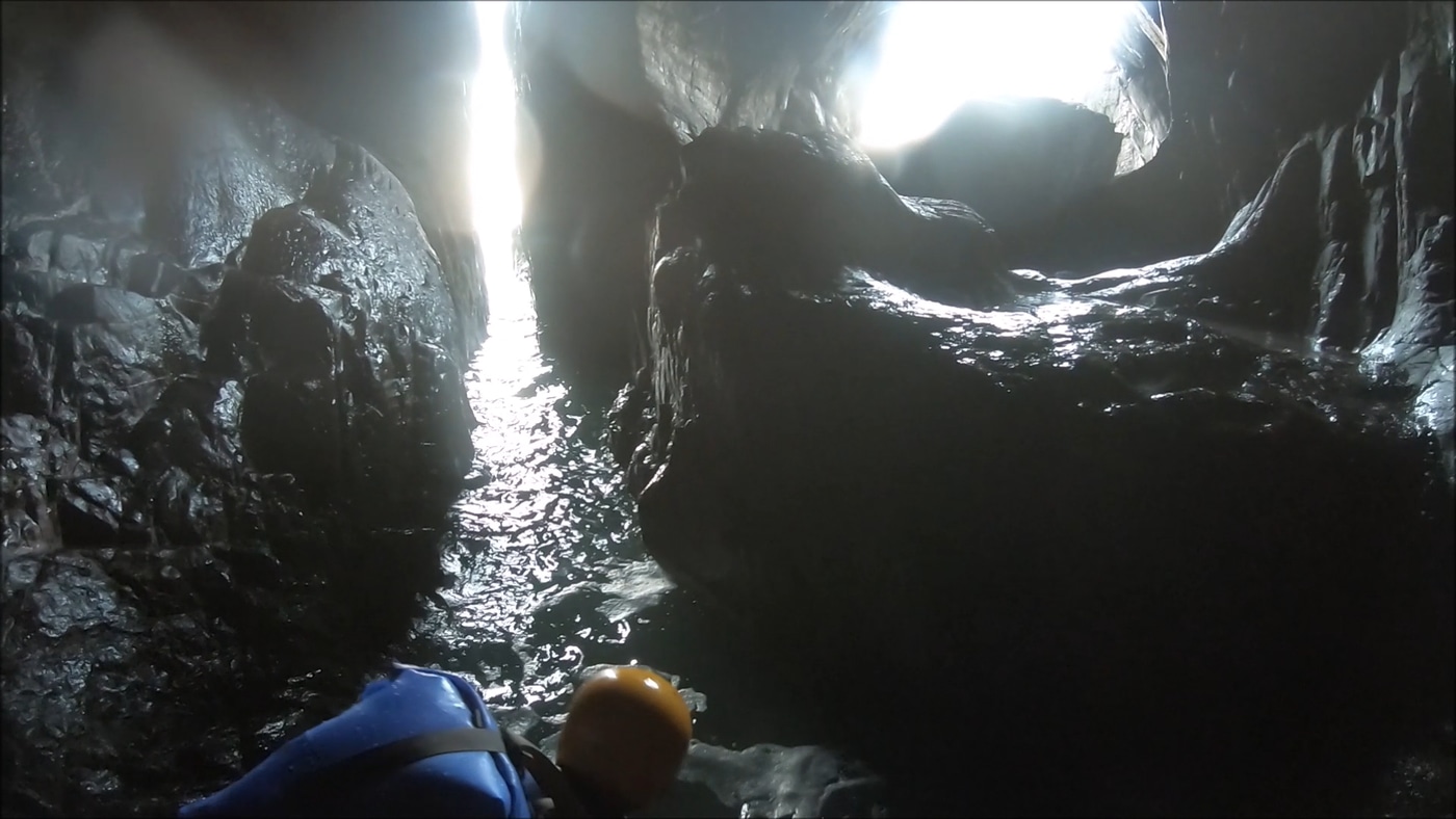Exploring a hidden double sea cave near Carn Naun Point between St Ives and Zennor in west Cornwall.