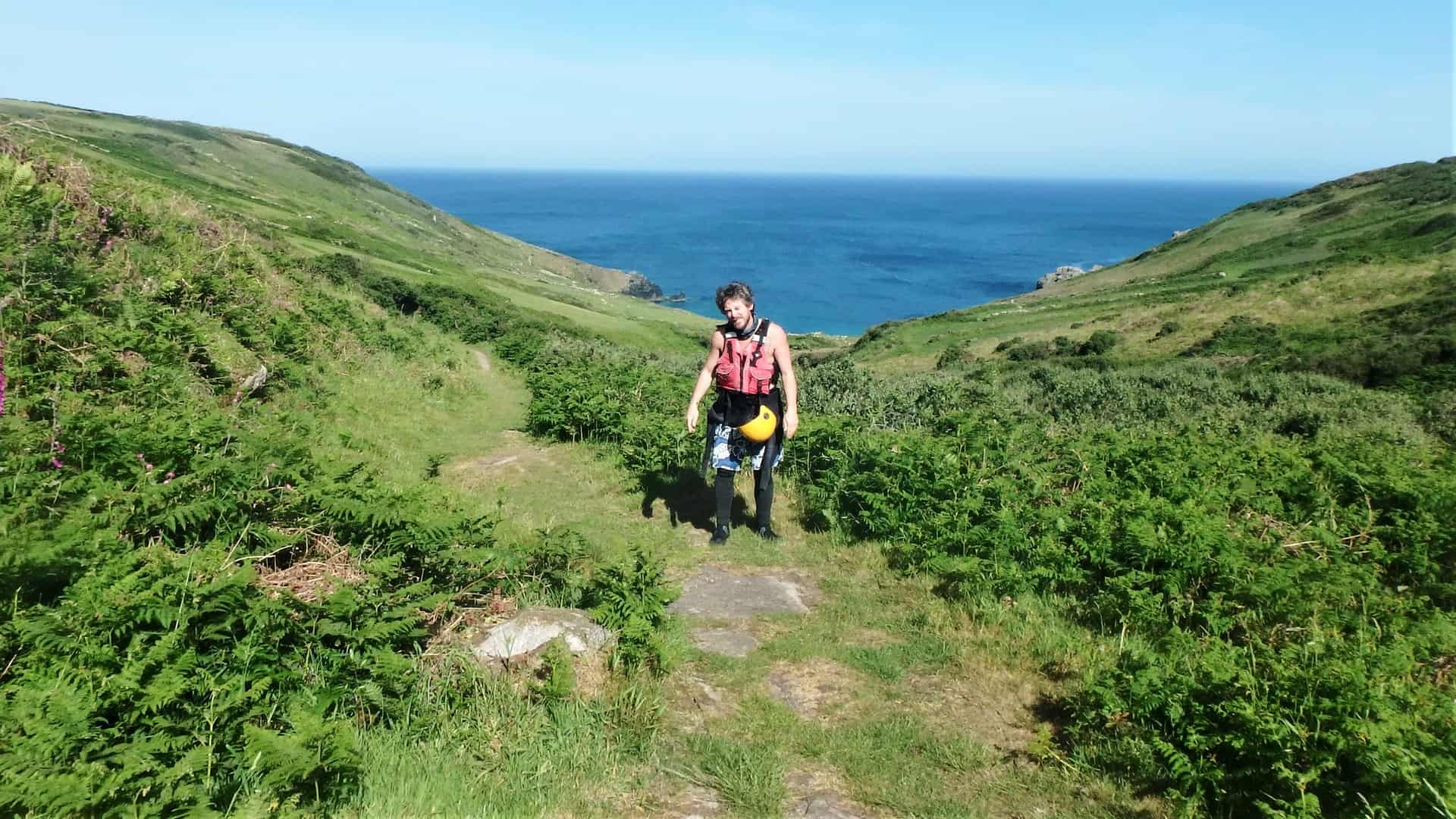 Kernow Coasteering guide Lee after exploring Porthmeor Cove near Zennor on the north coast of West Penwith, Cornwall