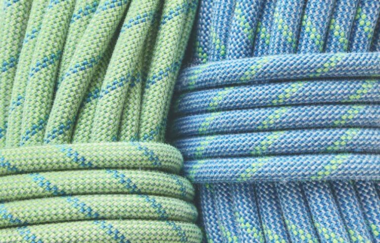 Close up to two climbing ropes coiled and ready for use