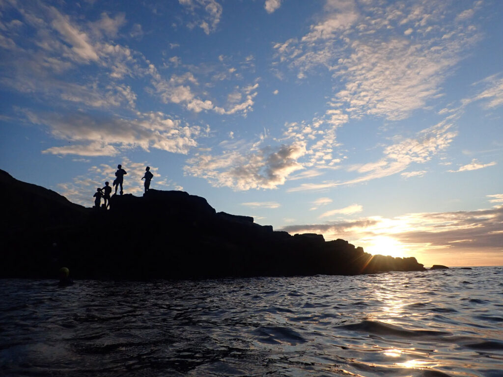 Coasteering at Land's End in Cornwall at Sunset