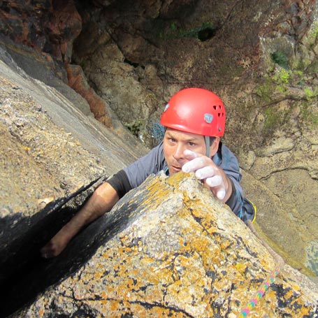 Intermediate climber focusing during one of the best activities to do in Cornwall