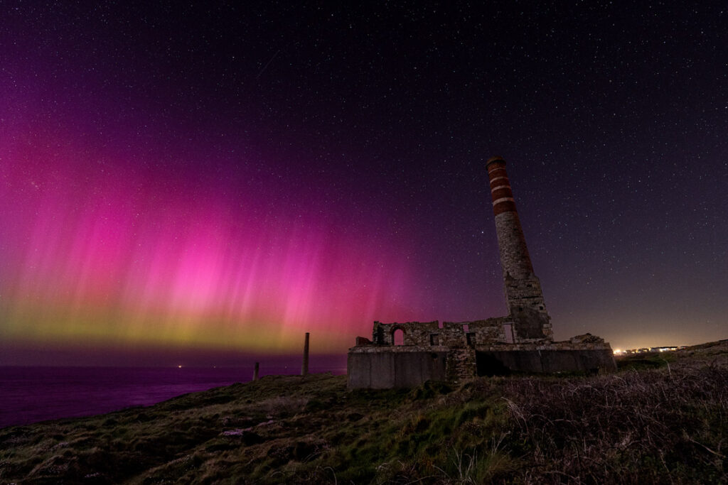 Aurora borealis glowing above the pumping house at Levant Mine, Cornwall – 2024 event