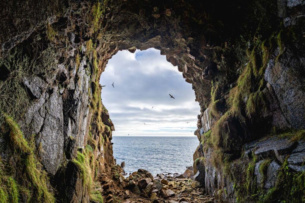 Looking out to sea from inside Mousehole Cave, Cornwall